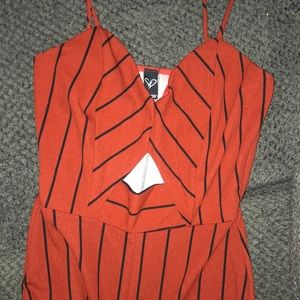 This a a jumpsuit orange womper